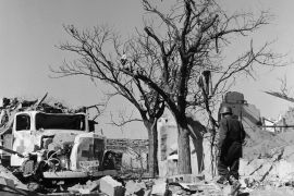 TUNISIA - FEBRUARY 12: A Soldier Examining The Ruins At Sakiet Sidi Youssef, Including Among Other Things A Red Cross Truck, On February 12, 1958. The Village Of Sakiet Sidi Youssef, Where Members Of The Algerian Nlf Had Sought Refuge, Was Bombed By The French Army On February 8, 1958. This Bombing Marked The Start Of The Conflict&#039;S Internationalization. (Photo by Keystone-France/Gamma-Keystone via Getty Images)